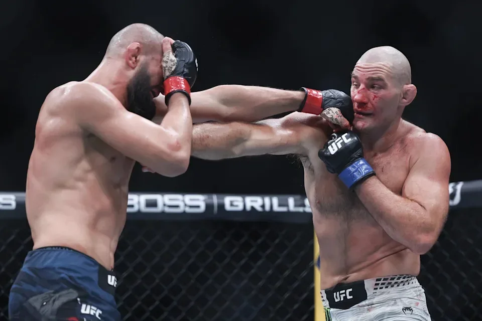 NEWARK, NEW JERSEY - MAY 09: Khamzat Chimaev of the United Arab Emirates, (L), punches Sean Strickland of the United States in a middleweight title bout during UFC 328 at the Prudential Center on May 09, 2026 in Newark, New Jersey. (Photo by Ishika Samant/Getty Images) | Getty Images